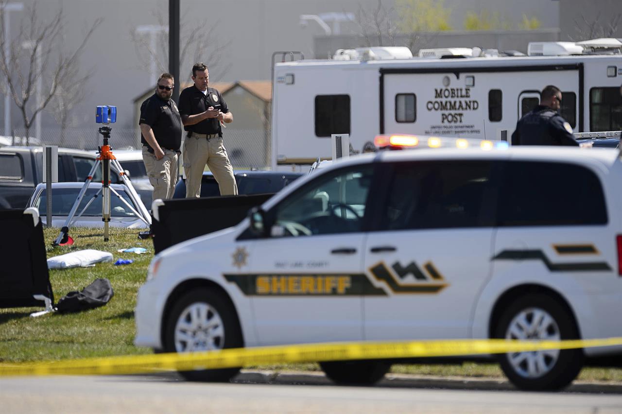 Police the scene of a shooting at the Salt Lake County Sheriff's Office, Saturday, April 10, 2021 in Salt Lake City. Two Utah sheriff’s deputies were wounded and the suspect was killed in a shooting outside the Salt Lake County jail. Officials said both deputies were taken to a hospital after the Saturday morning shootout and are expected to survive.(Trent Nelson/The Salt Lake Tribune via AP)
