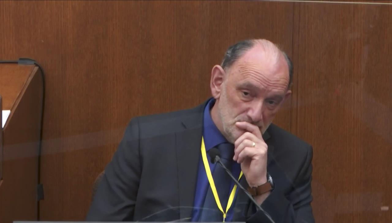 In this image from video, Dr. David Fowler, a retired forensic pathologist and former chief medical examiner for the state of Maryland is questioned by prosecutor Jerry Blackwell, as Hennepin County Judge Peter Cahill presides, Wednesday, April 14, 2021, in the trial of former Minneapolis police Officer Derek Chauvin at the Hennepin County Courthouse in Minneapolis, Minn. Chauvin is charged in the May 25, 2020 death of George Floyd. (Court TV via AP, Pool)