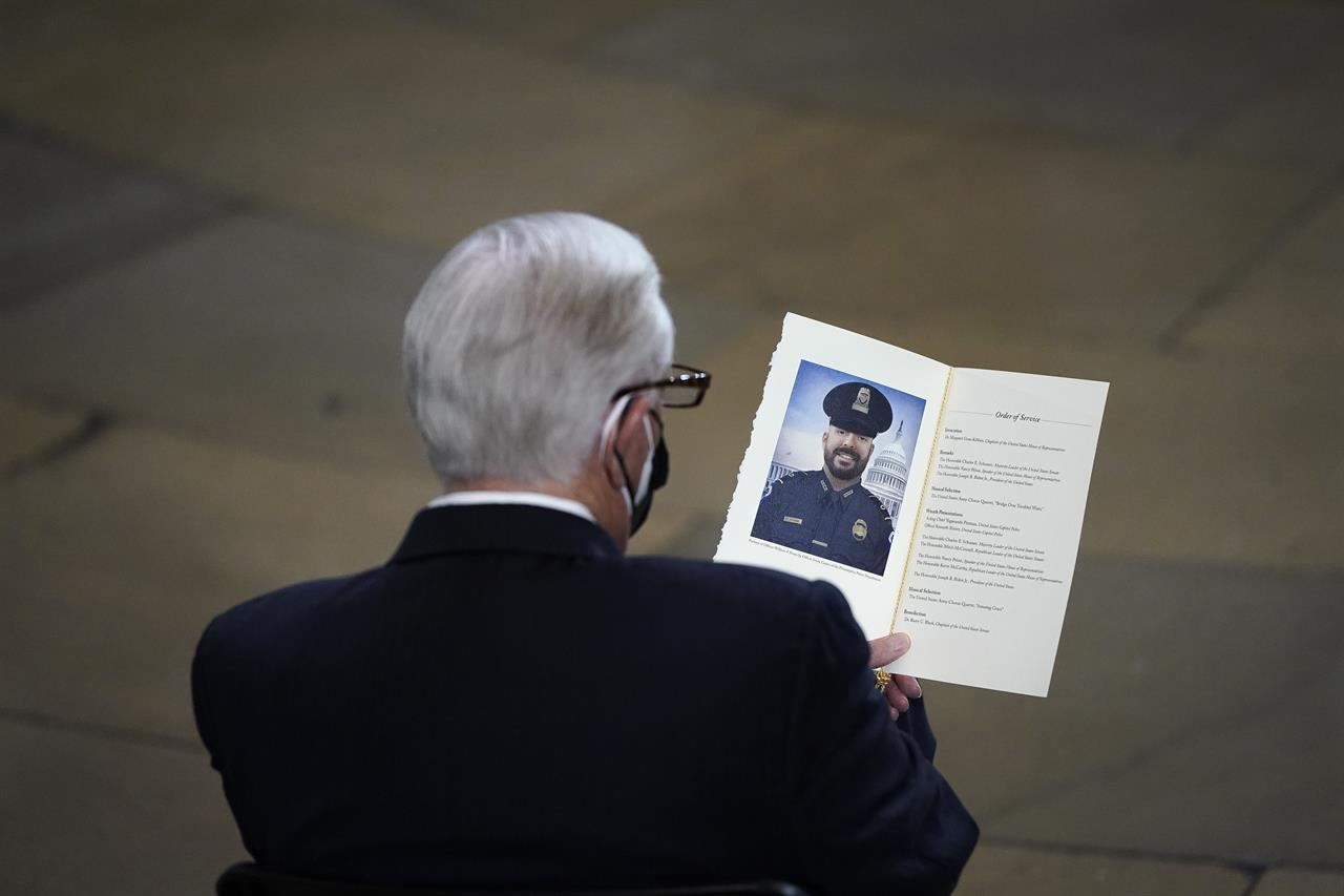 Rep. Steny Hoyer, D-Md., looks at a program at a memorial service for the late U.S. Capitol Police officer William "Billy" Evans in the Rotunda at the U.S. Capitol, Tuesday, April 13, 2021 in Washington. (Drew Angerer/Pool via AP)