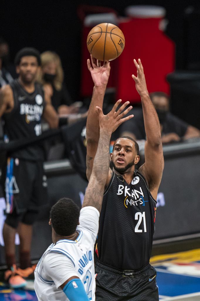 Brooklyn Nets center LaMarcus Aldridge (21) shoots over Los Angeles Lakers center Andre Drummond (2) during the first half of an NBA basketball game Saturday, April 10, 2021, in New York. (AP Photo/Corey Sipkin)