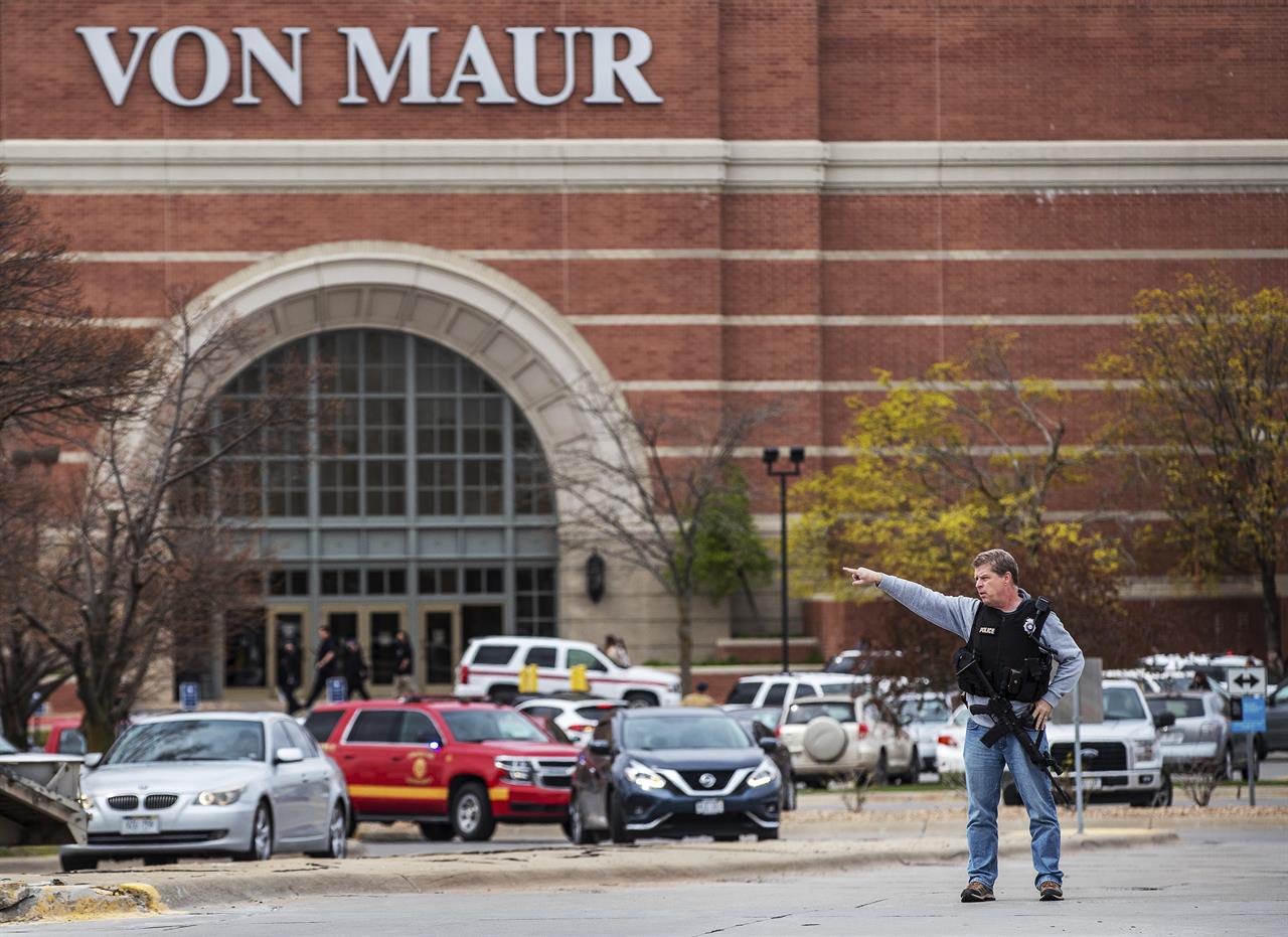 Law enforcement directs traffic away after a shooting at Westroads Mall on Saturday, April 17, 2021 in Omaha, Neb. Shots rang out Saturday in the mall, leaving one person critically wounded and sending shoppers running for the exit. (Chris Machian/Omaha World-Herald via AP)
