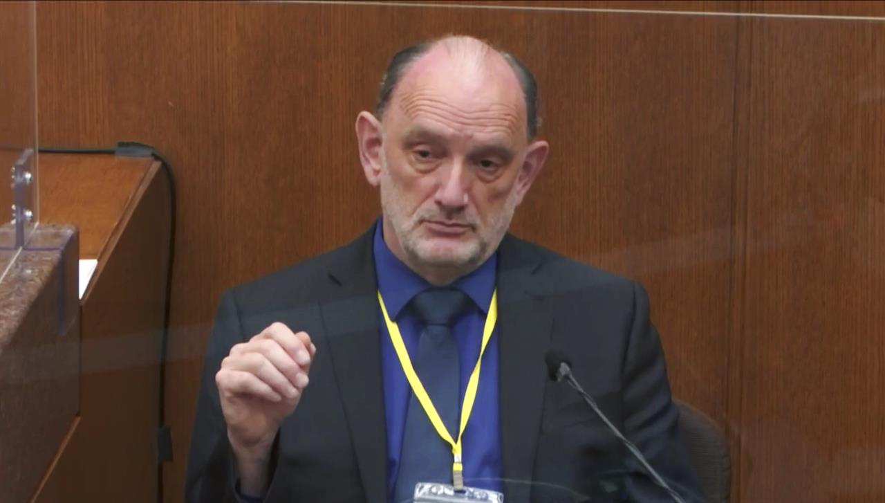 In this image from video, Dr. David Fowler, a retired forensic pathologist and former chief medical examiner for the state of Maryland testifies as Hennepin County Judge Peter Cahill presides, Wednesday, April 14, 2021, in the trial of former Minneapolis police Officer Derek Chauvin at the Hennepin County Courthouse in Minneapolis, Minn. Chauvin is charged in the May 25, 2020 death of George Floyd. (Court TV via AP, Pool)