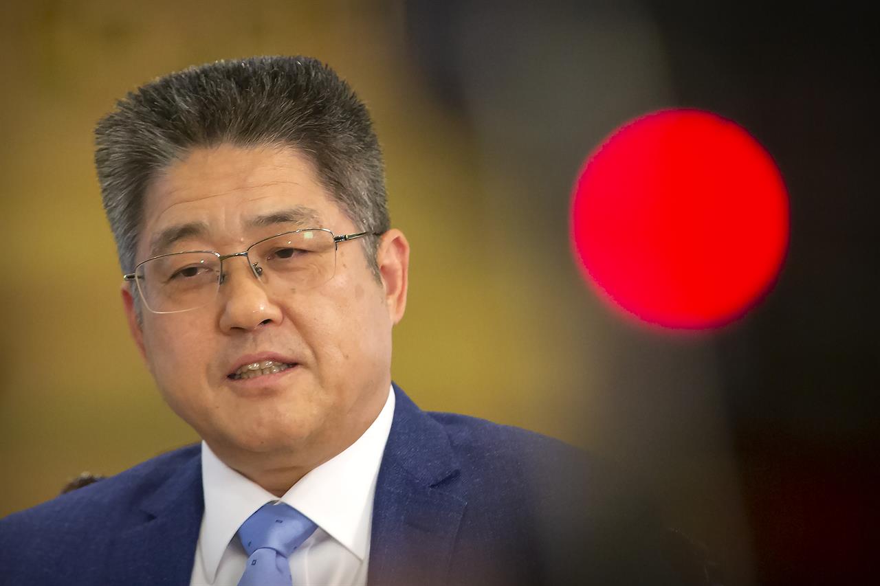 Chinese Vice Minister of Foreign Affairs Le Yucheng speaks during an interview with the Associated Press at the Ministry of Foreign Affairs in Beijing, Friday, April 16, 2021. Le spoke to AP on a wide range of issues during an interview on Friday including climate change and US-China relations. (AP Photo/Mark Schiefelbein)