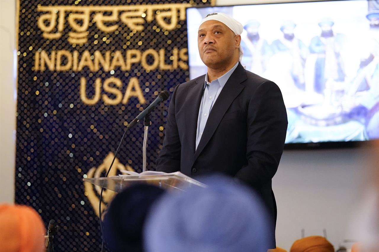 Rep. Andre Carson, D-Ind., speaks with members of the Sikh Coalition at the Sikh Satsang of Indianapolis in Indianapolis, Saturday, April 17, 2021, for a commemoration of the victims of the shooting at a FedEx facility in Indianapolis that claimed the lives of four members of the Sikh community. A gunman killed eight people and wounded several others before taking his own life in a late-night attack at a FedEx facility near the Indianapolis airport. (AP Photo/AJ Mast)