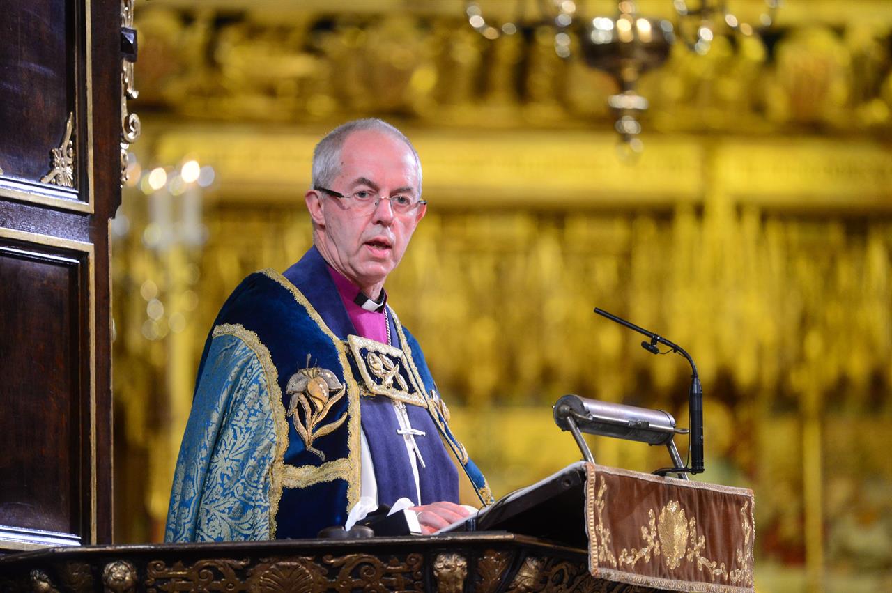 FILE - In this Sunday Nov. 11, 2018 file photo, Archbishop of Canterbury Justin Welby makes an address during a National Service to mark the centenary of the Armistice at Westminster Abbey, London. A report published Thursday April 22, 2021 aiming to tackle racism in the Church of England has recommended dozens of proposals to end decades of inaction, including the requirement that at least one ethnic minority candidate be included in shortlists for senior clergy roles. (Paul Grover/Pool photo via AP)