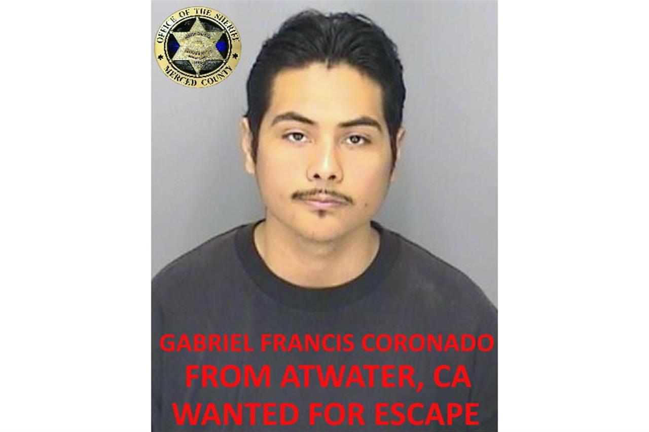 This undated booking photo released by the Merced County Sheriff's Office shows escapee inmate Gabriel Francis Coronado, from Atwater, Calif. Authorities in central California are searching for six inmates, including Coronado, who used a "homemade rope" to escape from a county jail. The Merced County Sheriff's Office says all six should be considered armed and dangerous. Staff at Merced County Downtown Jail noticed late Saturday, Jan. 10, 2021, that the six inmates were missing. (Merced County Sheriff's Office via AP)