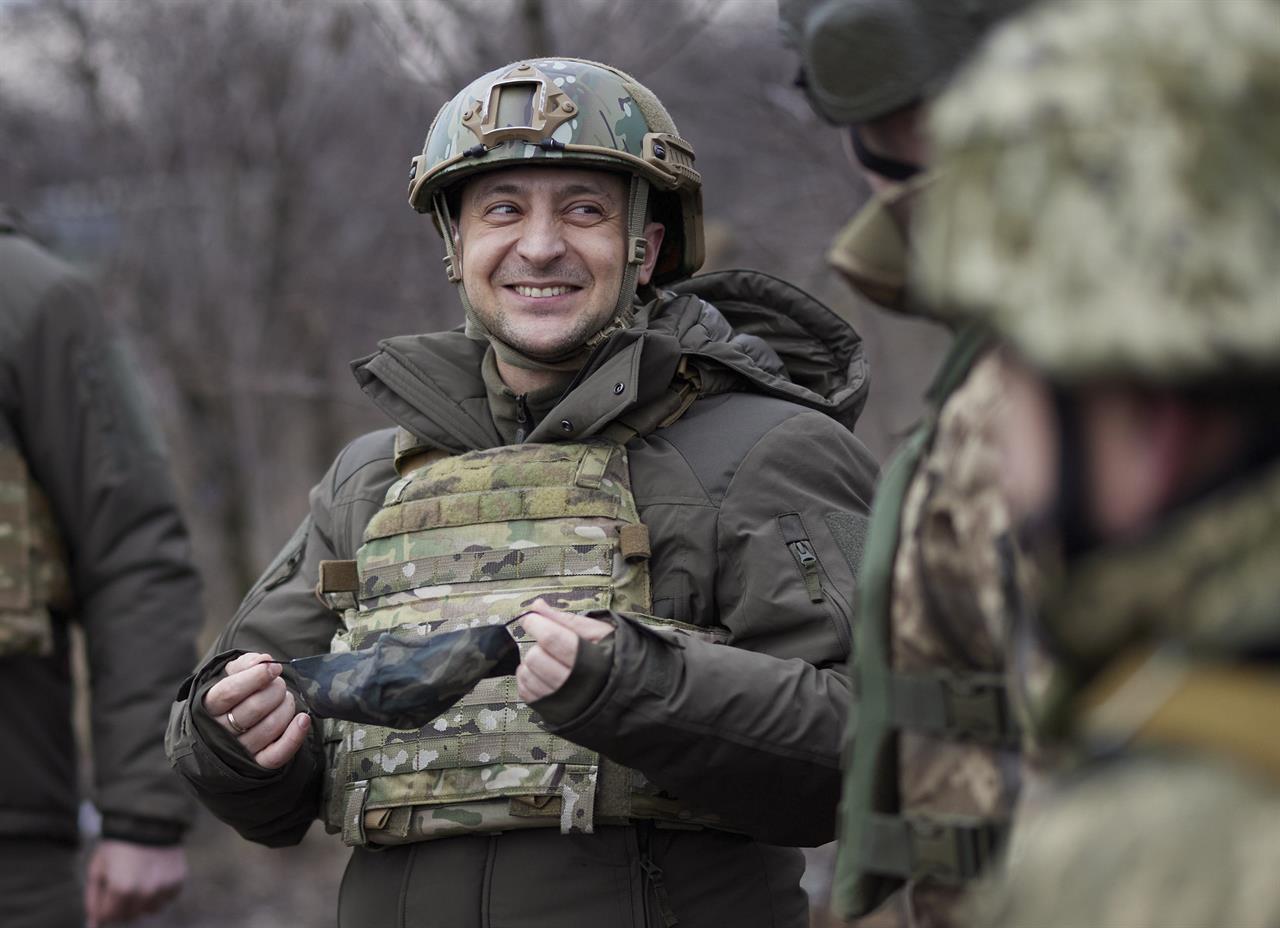 FILE - In this Thursday, Feb. 11, 2021 file photo, Ukrainian President Volodymyr Zelenskyy talks with servicemen as he visits the war-hit Donetsk region, eastern Ukraine. On the frontlines of the battle against Russia-backed separatists and in the halls of government in Kyiv, Ukrainians hold strong hopes for the visit of the U.S. Secretary of State — increased military aid and strong support for NATO membership among them. (Ukrainian Presidential Press Office via AP, File)