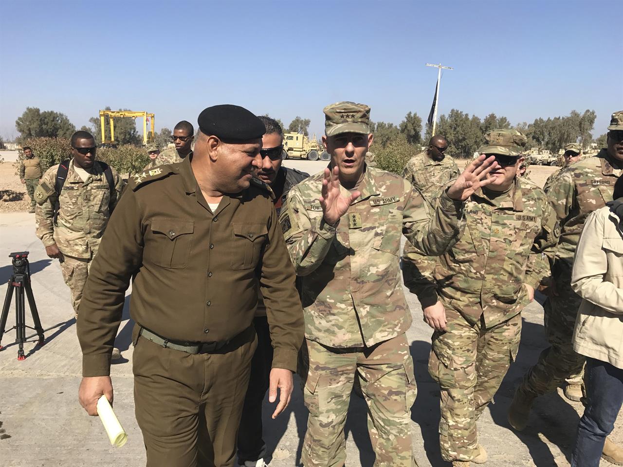 FILE - In this Feb. 8, 2017, file photo, then-Army Lt. Gen. Stephen Townsend talks with an Iraqi officer during a tour north of Baghdad, Iraq. Townsen, now a general, says a growing military threat from China may well come from America’s east, as Beijing looks to establish a large navy port capable of hosting submarines or aircraft carriers on the Atlantic coast of Africa.(AP Photo/ Ali Abdul Hassan, File)