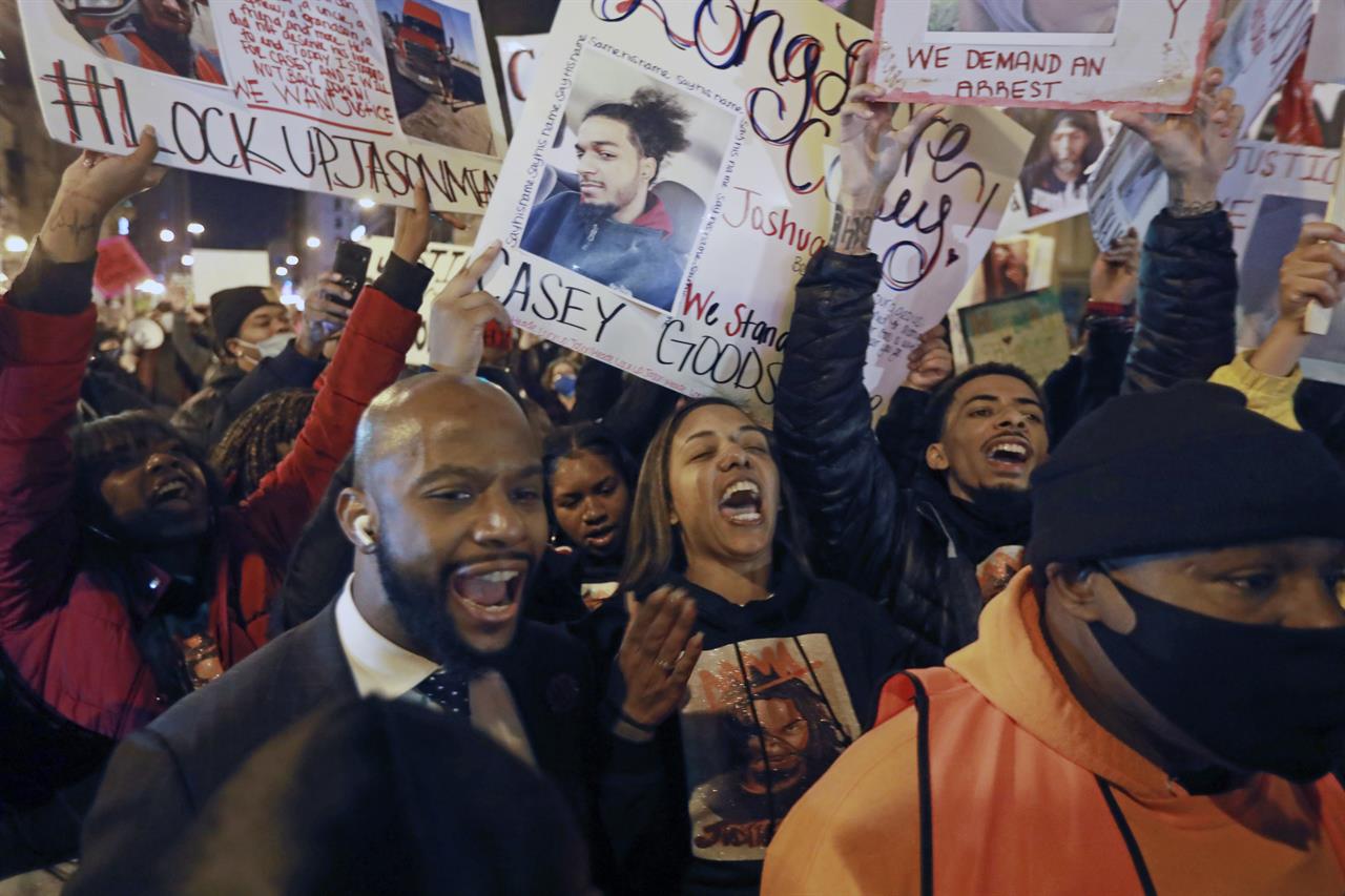 FILE - In this Friday, Dec. 11, 2020 file photo, Tamala Payne, center, with attorney Sean Walton, participate during a protest march for the shooting of her son, Casey Goodson Jr., by a Franklin County deputy sheriff in Columbus, Ohio. The Ohio deputy who shot Casey Goodson Jr. in the back five times last year is retiring on disability, the Franklin County sheriff said Friday, June 4, 2021. Goodson, 23, a Black man, was fatally shot by Deputy Jason Meade, who is white, last December in an encounter that is still largely unexplained. (Doral Chenoweth/The Columbus Dispatch via AP)