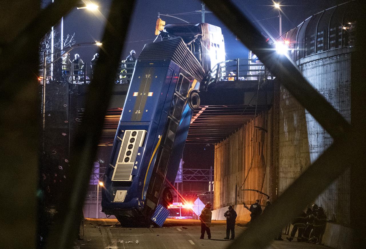 FILE - This Friday Jan. 15, 2021 file photo, shows a New York City bus which drove off Bronx overpass and crashed into the road below. The driver, Everton Beccan, 55, blamed the crash on mechanical failure, while disputing the Metropolitan Transportation Authority's assertion that he had refused to submit to a drug and alcohol test. (AP Photo/Craig Ruttle, File)