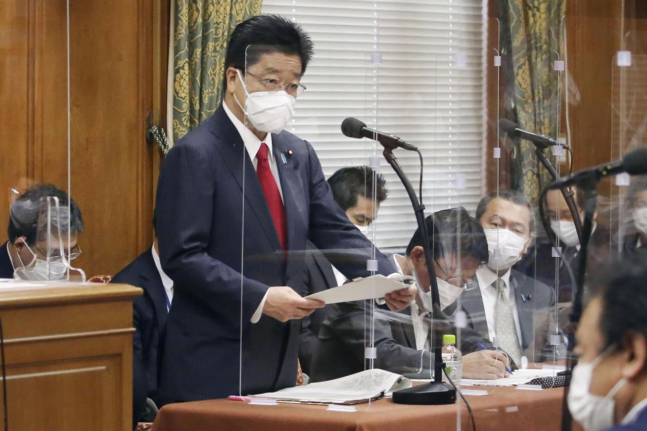 Japan's Chief Cabinet Secretary Katsunobu Kato speaks during a committee at the lower house in Tokyo, Friday, June 11, 2021. Kato told a regular news conference Friday that “Japan’s position is to maintain relations with Taiwan as those of practical and non-governmental” as stated in the 1972 Japan-China joint declaration. As China increases its influence in the region and tension rises, Taiwan has become a sensitive topic, especially as Japan, the U.S. and other democracies move closer to Taipei. (Toshiyuki MatsumotoKyodo News via AP)