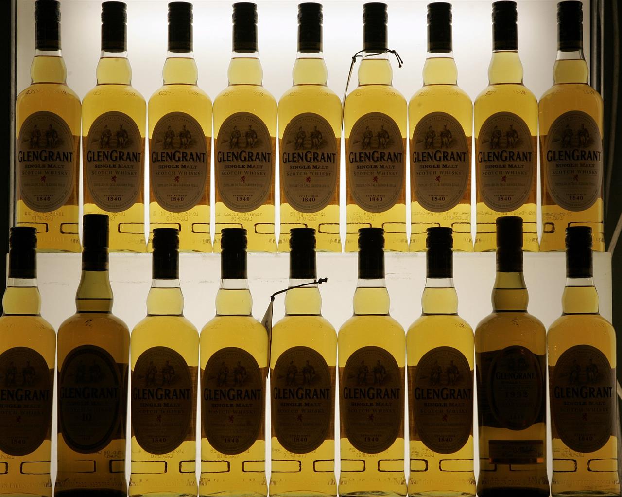 FILE- This Friday, Nov. 13, 2009, file photo, shows Scotch bottles in Cologne, Germany. Scotch whisky makers are breathing a sigh of relief after the United States agreed to suspend tariffs on one of Scotland’s main exports. U.S. President Donald Trump imposed a 25% tariff on single malt Scotch whisky in 2019 as part of a trade dispute between the U.S. and EU countries over aerospace subsidies. (AP Photo/Hermann J. Knippertz, File)