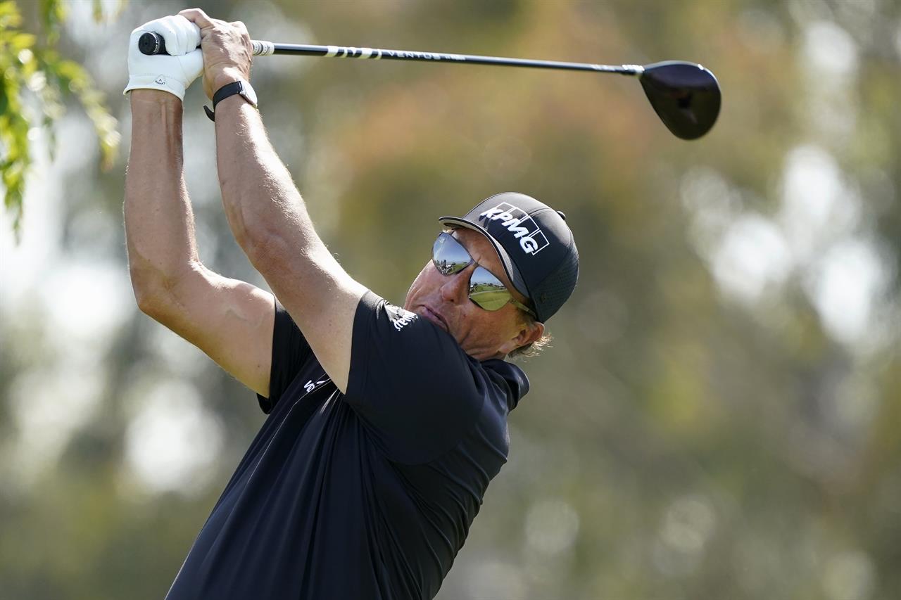 Phil Mickelson plays his shot from the 12th tee during the first round of the U.S. Open Golf Championship, Thursday, June 17, 2021, at Torrey Pines Golf Course in San Diego. (AP Photo/Marcio Jose Sanchez)
