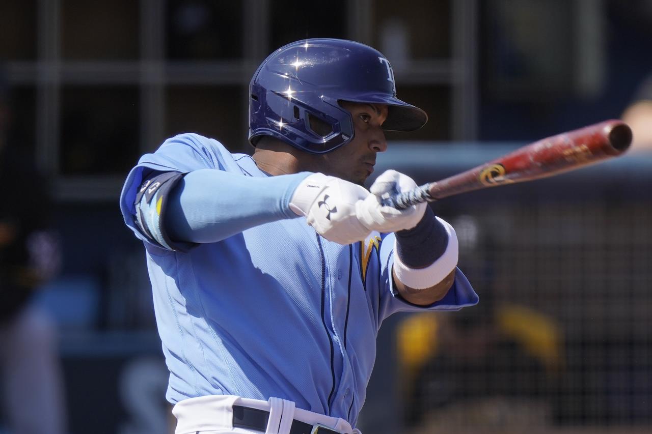 FILE - In this March 3, 2021, file photo, Tampa Bay Rays' Wander Franco hits a home run in the first inning during a spring training baseball game against the Pittsburgh Pirates in Port Charlotte, Fla. Franco is being called up to make his major league debut against Boston on Tuesday, June 22, 2021. He is regarded as the top prospect in the minor leagues. (AP Photo/Brynn Anderson, File)