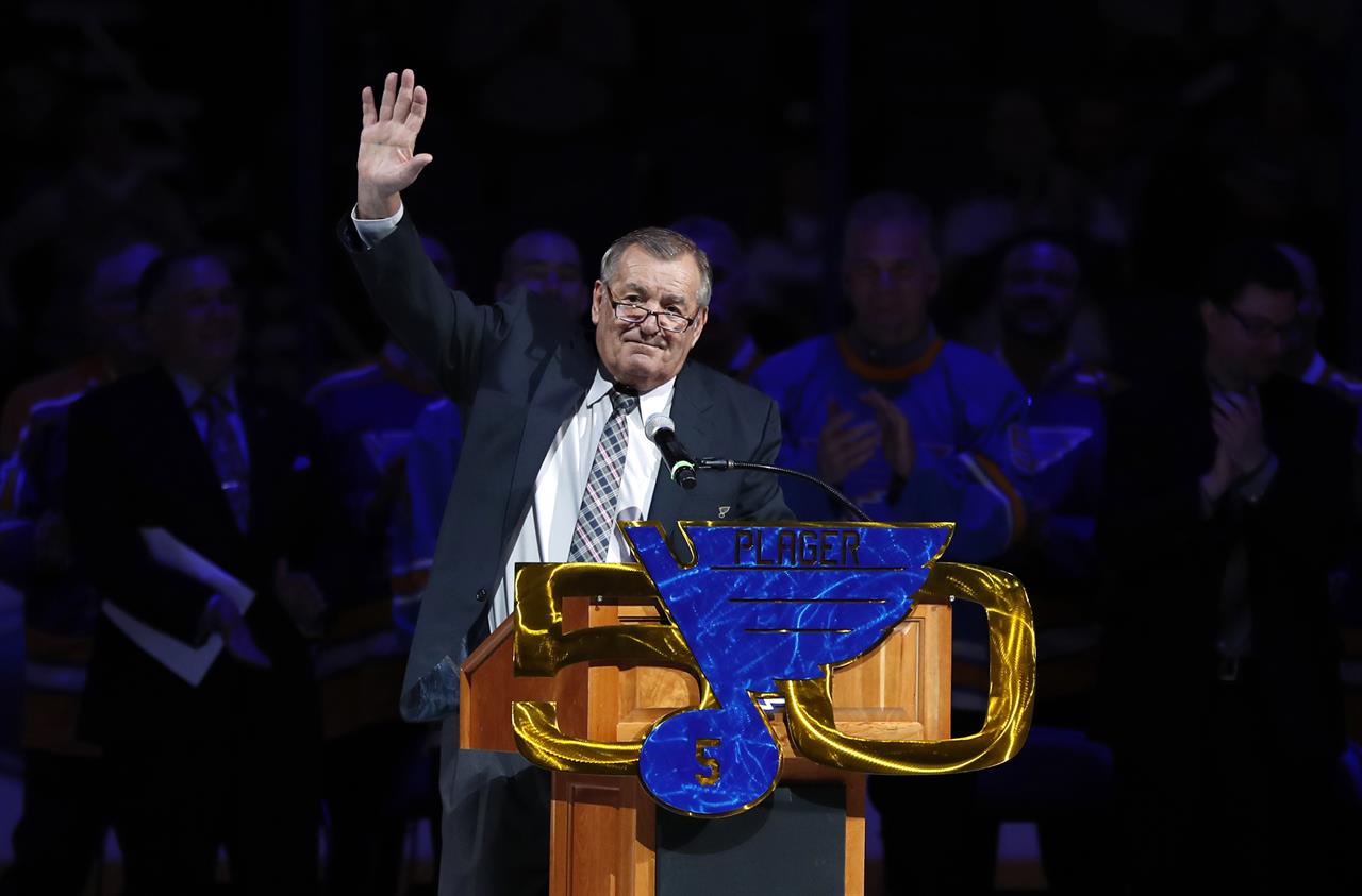 FILE - In this Thursday, Feb 2, 2017 file photo, former St. Louis Blues player Bob Plager waves to fans while speaking during a ceremony to retire his number before an NHL hockey game in St. Louis. The final report on the cause of death Bob Plager has confirmed that he died of a "cardiac event" before crashing his SUV in March 2021. St. Louis Medical Examiner Dr. Michael Graham revealed the final report on Tuesday, June 23, 2021, confirming his preliminary findings from shortly after Plager's death. (AP Photo/Jeff Roberson, File)