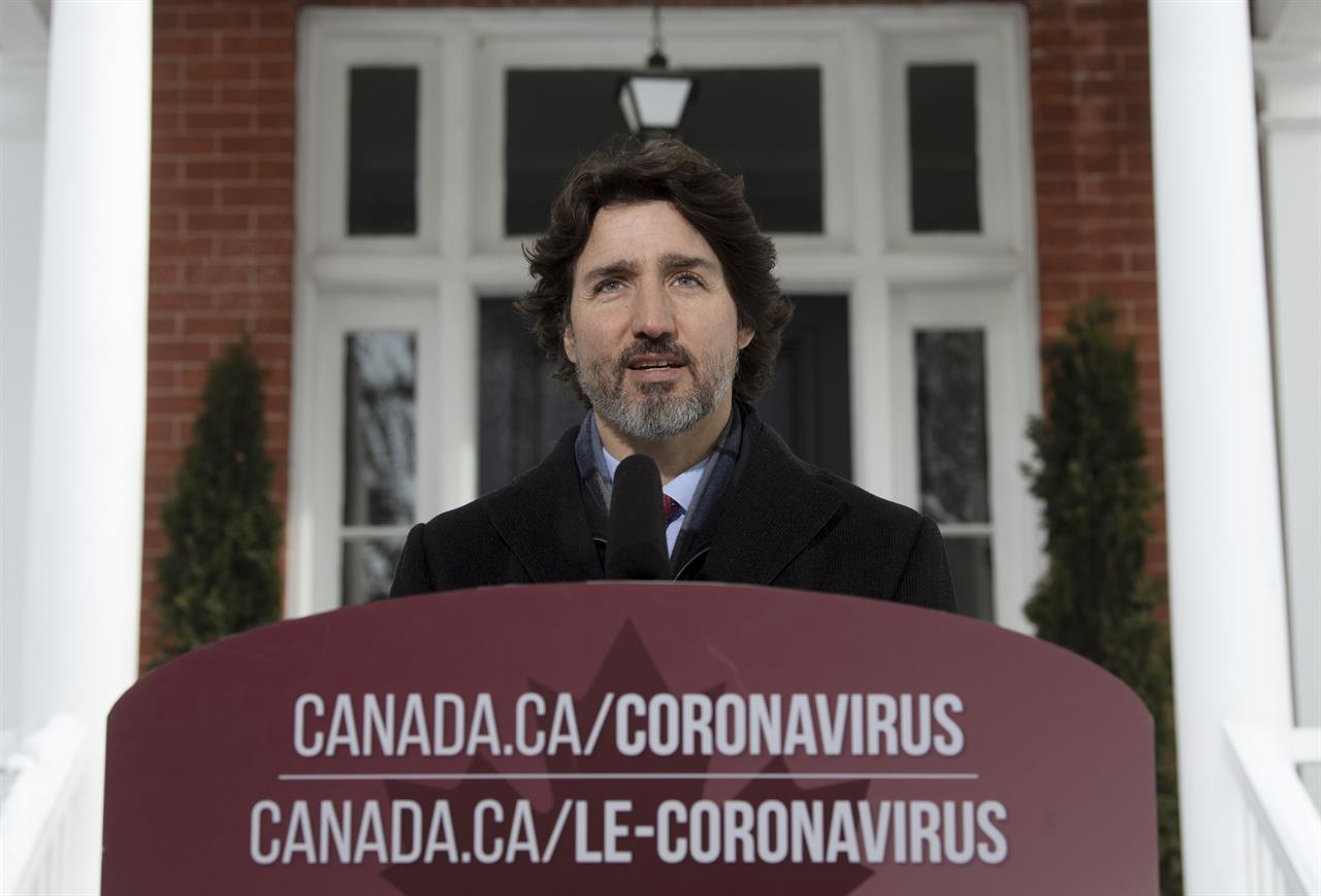 Canadian Prime Minister Justin Trudeau delivers his opening remarks at a news conference outside Rideau cottage in Ottawa, Ontario, Tuesday, Jan. 19, 2021. (Adrian Wyld/The Canadian Press via AP)