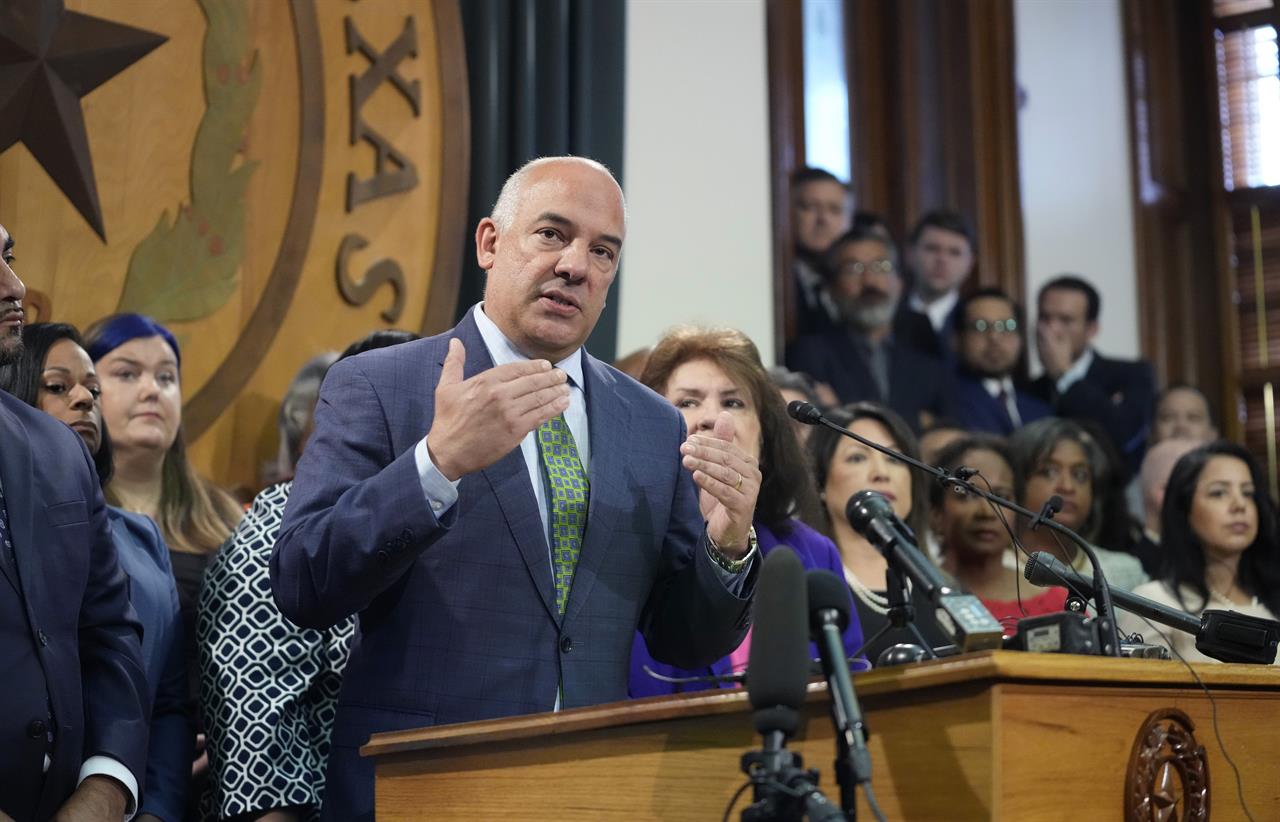 FILE - In this Thursday, July 8, 2021 file photo, Texas Rep. Chris Turner, D-Arlington, speaks as the Democratic members of the Texas House gather after a recess in the opening day of a special session in Austin, Texas. Three of the Democratic state lawmakers who fled Texas to stymie a Republican-backed effort to impose broad new voting restrictions have tested positive for COVID-19, the Texas House's Democratic caucus said Saturday, July 17, 2021. “This is a sober reminder that COVID is still with us, and though vaccinations offer tremendous protection, we still must take necessary precautions,” caucus Chairman Chris Turner said in the statement, adding that the caucus was conferring with health experts in Texas to get additional guidance. (AP Photo/Eric Gay, File)