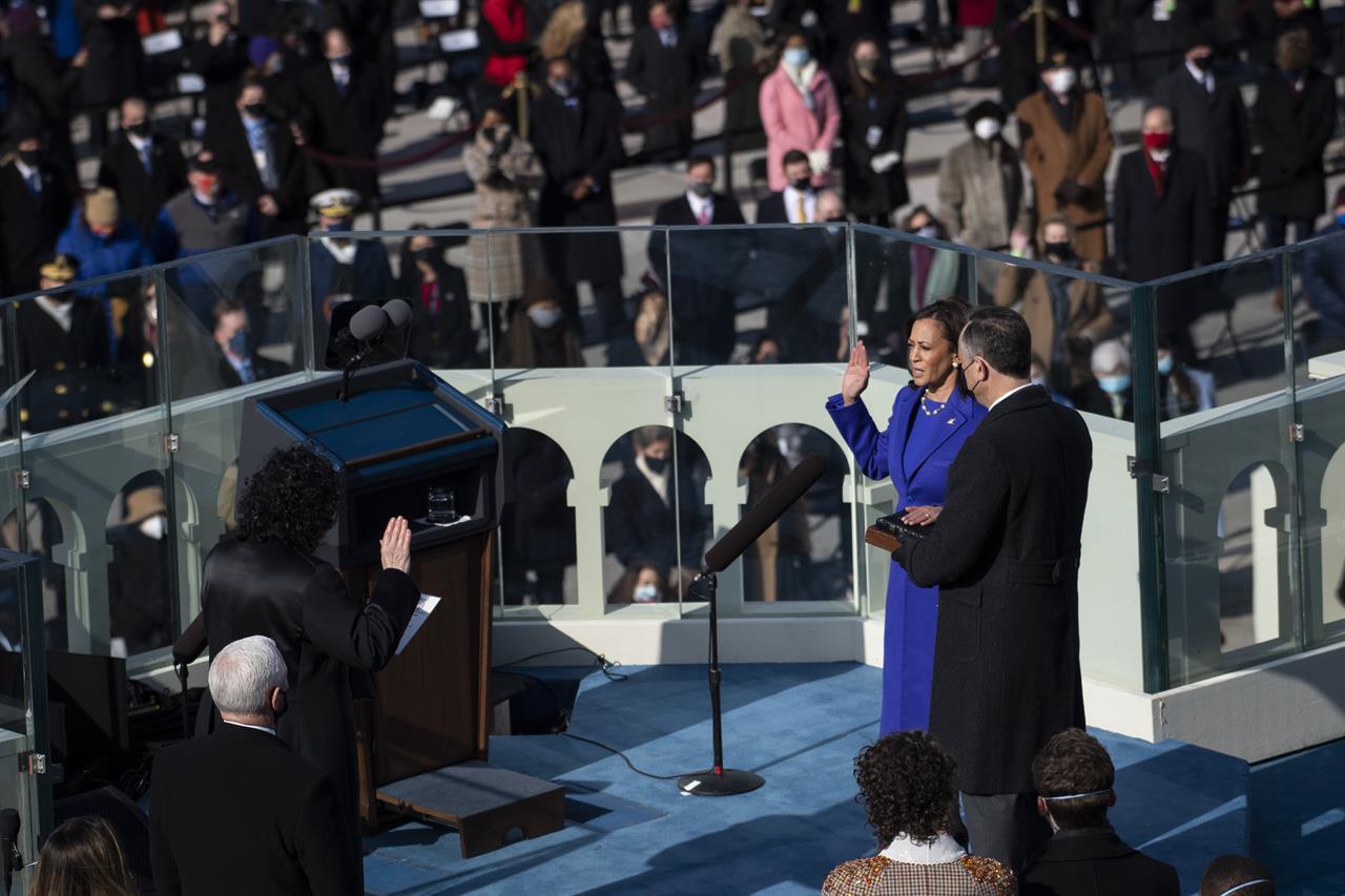 Kamala Harris is sworn in as vice president by Supreme Court Justice Sonia Sotomayor as her husband Doug Emhoff holds the Bible during the 59th Presidential Inauguration at the U.S. Capitol in Washington, Wednesday, Jan. 20, 2021. (Caroline Brehman/Pool Photo via AP)