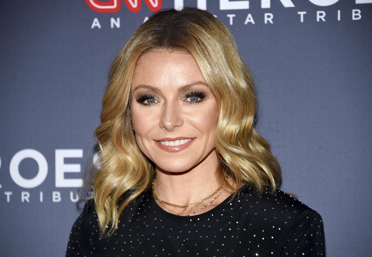 FILE - In this Dec. 9, 2018 file photo, Host Kelly Ripa attends the 12th annual CNN Heroes: An All-Star Tribute at the American Museum of Natural History in New York. Ripa is now an author. Dey Street Books, a HarperCollins Publishers imprint, announced Tuesday, July 20, 2021, that Ripa’s essay collection “Live Wire” will come out next year. (Photo by Evan Agostini/Invision/AP, File)