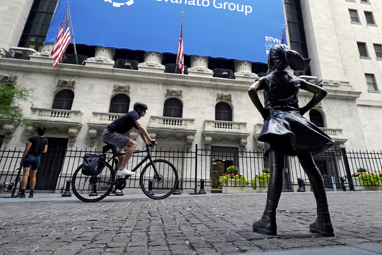 The Fearless Girl statue faces the New York Stock Exchange, Tuesday, July 20, 2021. (AP Photo/Richard Drew)