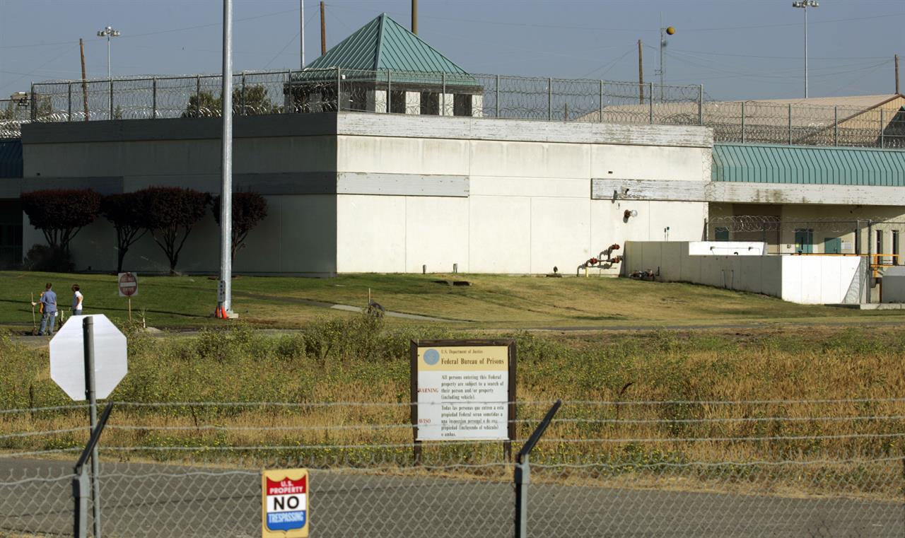 FILE - In this July 20, 2006, file photo, the Federal Correctional Institution in Dublin, Calif. Federal investigators have questioned the warden of the federal women's prison in California and searched his office. It comes weeks after a former correctional officer at the facility was arrested on charges of sexually abusing inmates. It wasn't immediately clear if the search at the Federal Correctional Institution at Dublin was connected to last month's arrest. (AP Photo/Ben Margot, File)
