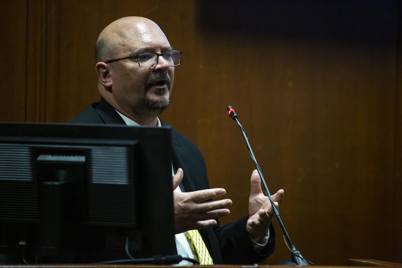 FILE - In this May 24, 2021, file photo, Division of Criminal Investigation Special Agent Trent Vileta answers questions from the witness stand during Cristhian Bahena Rivera's trial in the Scott County Courthouse, in Davenport, Iowa. Bahena Rivera is on trial after being charged with first degree murder in the death of Mollie Tibbetts in July 2018. Vileta, expressed confidence Tuesday, July 27, 2021, that the right man was convicted, rejecting defense claims that her abduction could be tied to other local criminal suspects. (Kelsey Kremer/The Des Moines Register via AP, Pool, File)