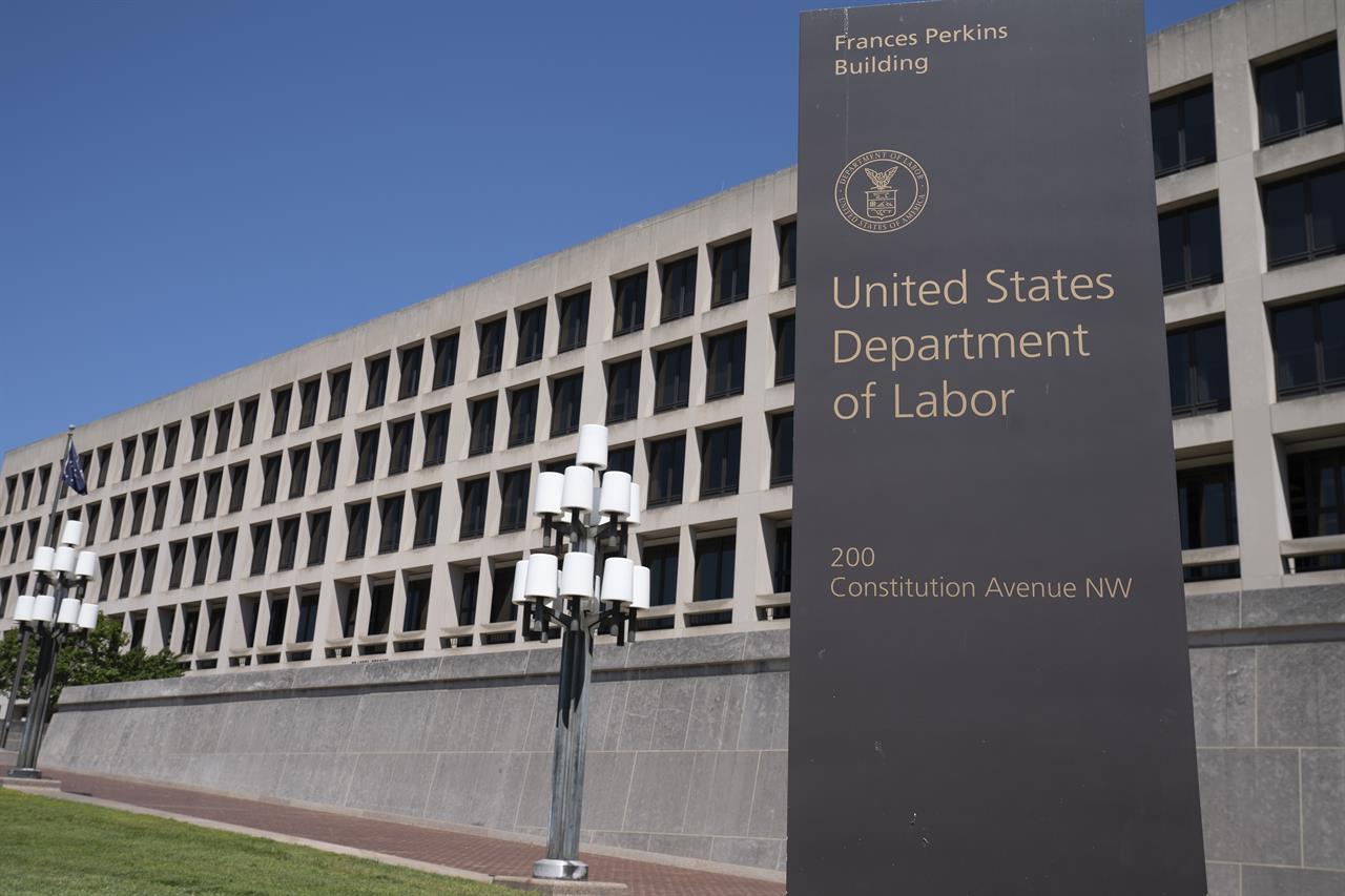 FILE - The entrance to the Labor Department is seen near the Capitol in Washington, Thursday, May 7, 2020. Civil rights groups on Thursday, Jan. 21, 2021 celebrated President Joe Biden’s swift revocation of a Trump administration order that had banned federal agencies, contractors and recipients of federal funding from conducting certain diversity training. The Department of Labor had already suspended enforcement of the order after a California federal court granted a preliminary injunction against it in response to a lawsuit filed by Lambda Legal, an organization that advocates for the rights of LGBT people. (AP Photo/J. Scott Applewhite, file)