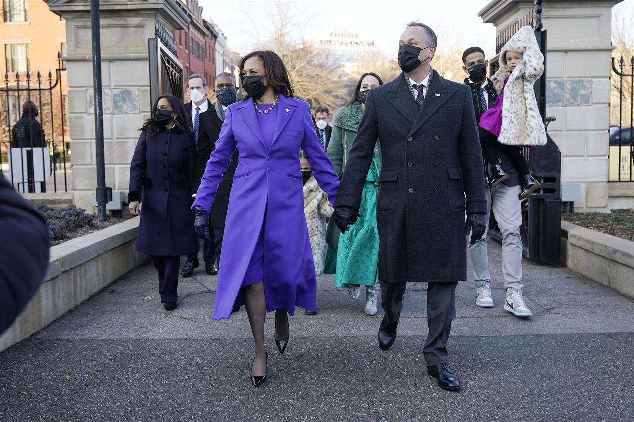 Vice President Kamala Harris, and her husband Doug Emhoff, and family, walk near the White House during a Presidential Escort to the White House, Wednesday, Jan. 20, 2021 in Washington, after being sworn in as the 46th vice president of the United States. (AP Photo/Jacquelyn Martin)