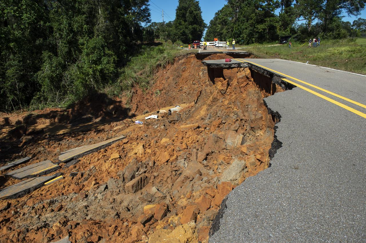 Part of Highway 26 washed away late Monday night, due to heavy rains from Hurricane Ida in the Benndale community in George County, Tuesday, Aug. 31, 2021. (Hannah Ruhoff/The Sun Herald via AP)