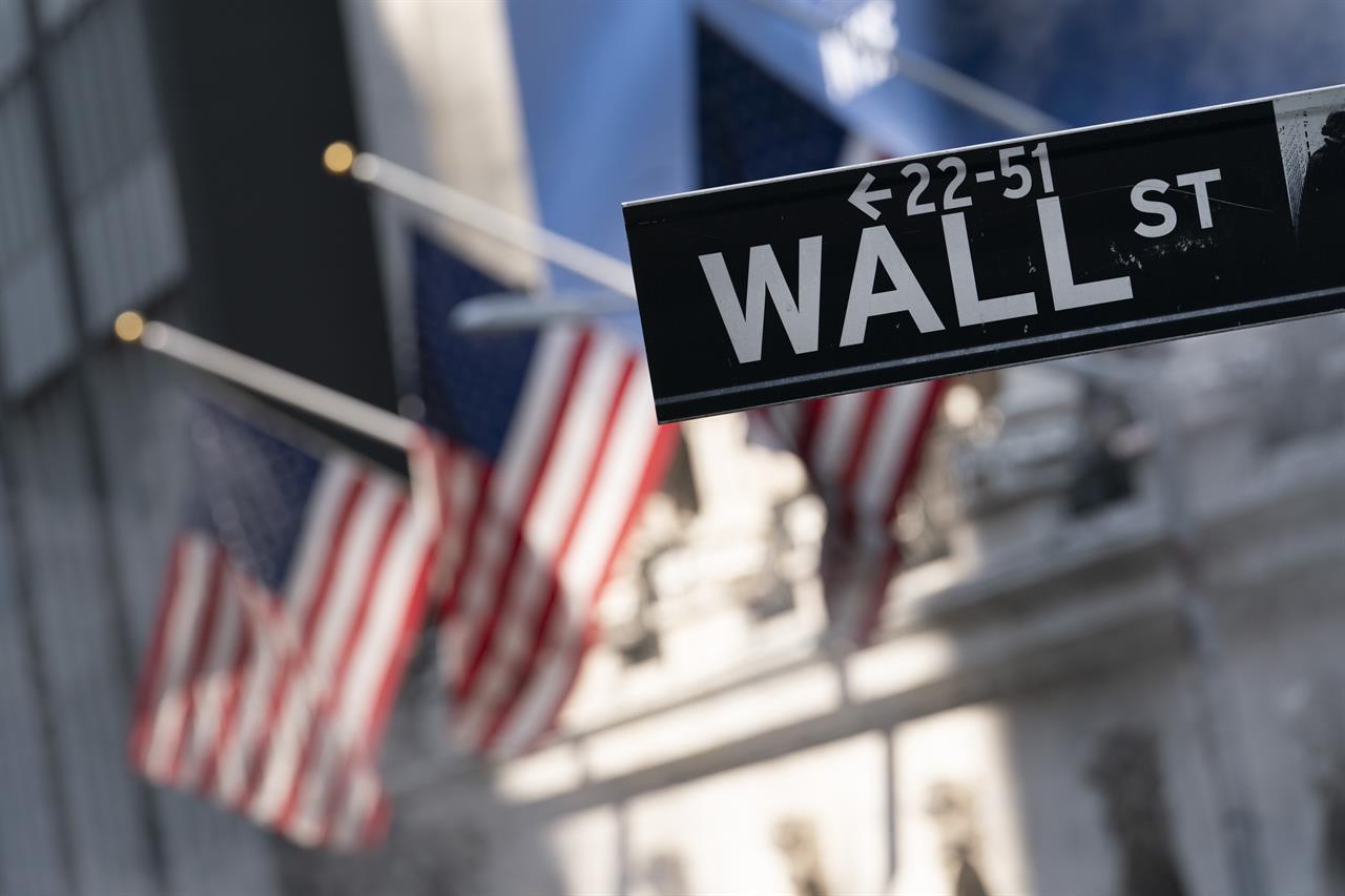 A sign for Wall Street hangs in front of the New York Stock Exchange, July 8, 2021. Stocks edged lower in morning trading, quickly reversing course after a brief gain following the latest data on inflation. Communications and industrial companies had some of the broadest losses, while health care stocks gained ground. U.S. consumer prices rose a lower-than-expected 0.3% last month, the smallest increase in seven months and a hopeful sign that inflation pressures may be cooling. (AP Photo/Mark Lennihan, file)