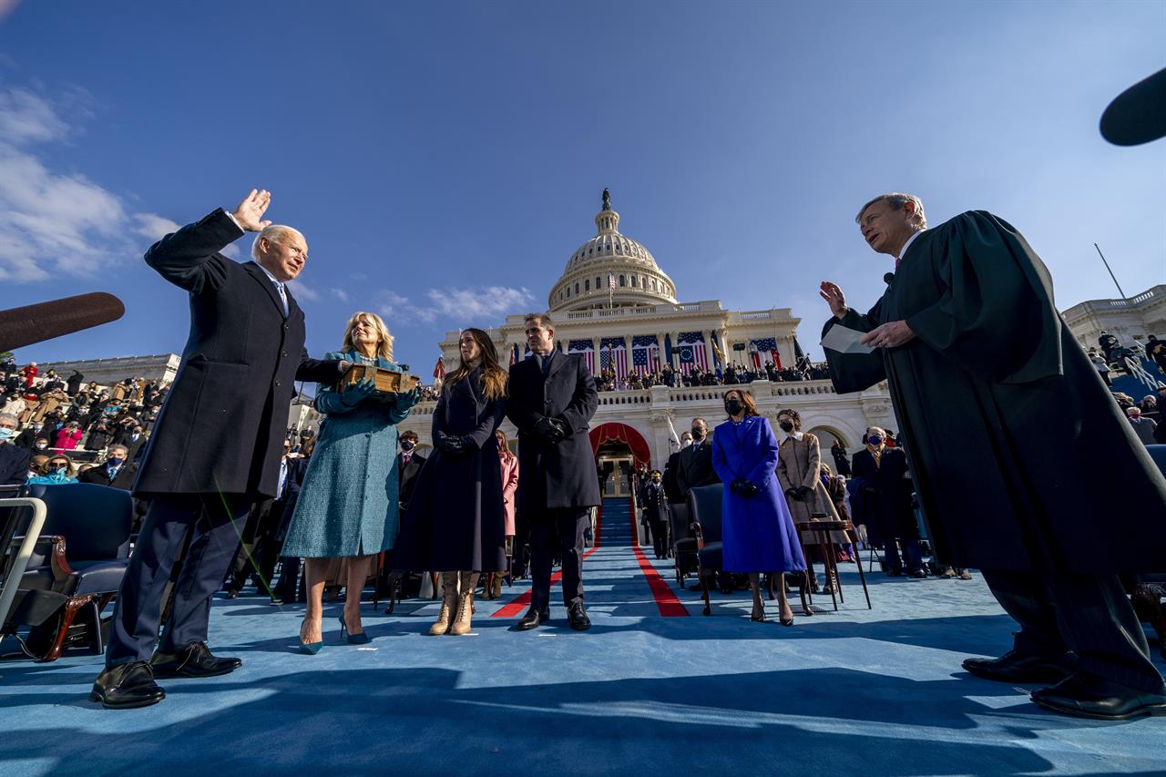 Joe Biden is sworn in as the 46th president of the United States by Chief Justice John Roberts as Jill Biden holds the Bible during the 59th Presidential Inauguration at the U.S. Capitol in Washington, Wednesday, Jan. 20, 2021, as their children Ashley and Hunter watch.(AP Photo/Andrew Harnik, Pool)