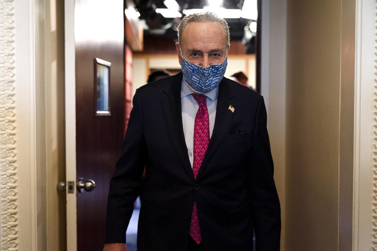 Senate Majority Leader Chuck Schumer of N.Y., leaves a news conference, Tuesday, Jan. 26, 2021, on Capitol Hill in Washington. (AP Photo/Jacquelyn Martin)