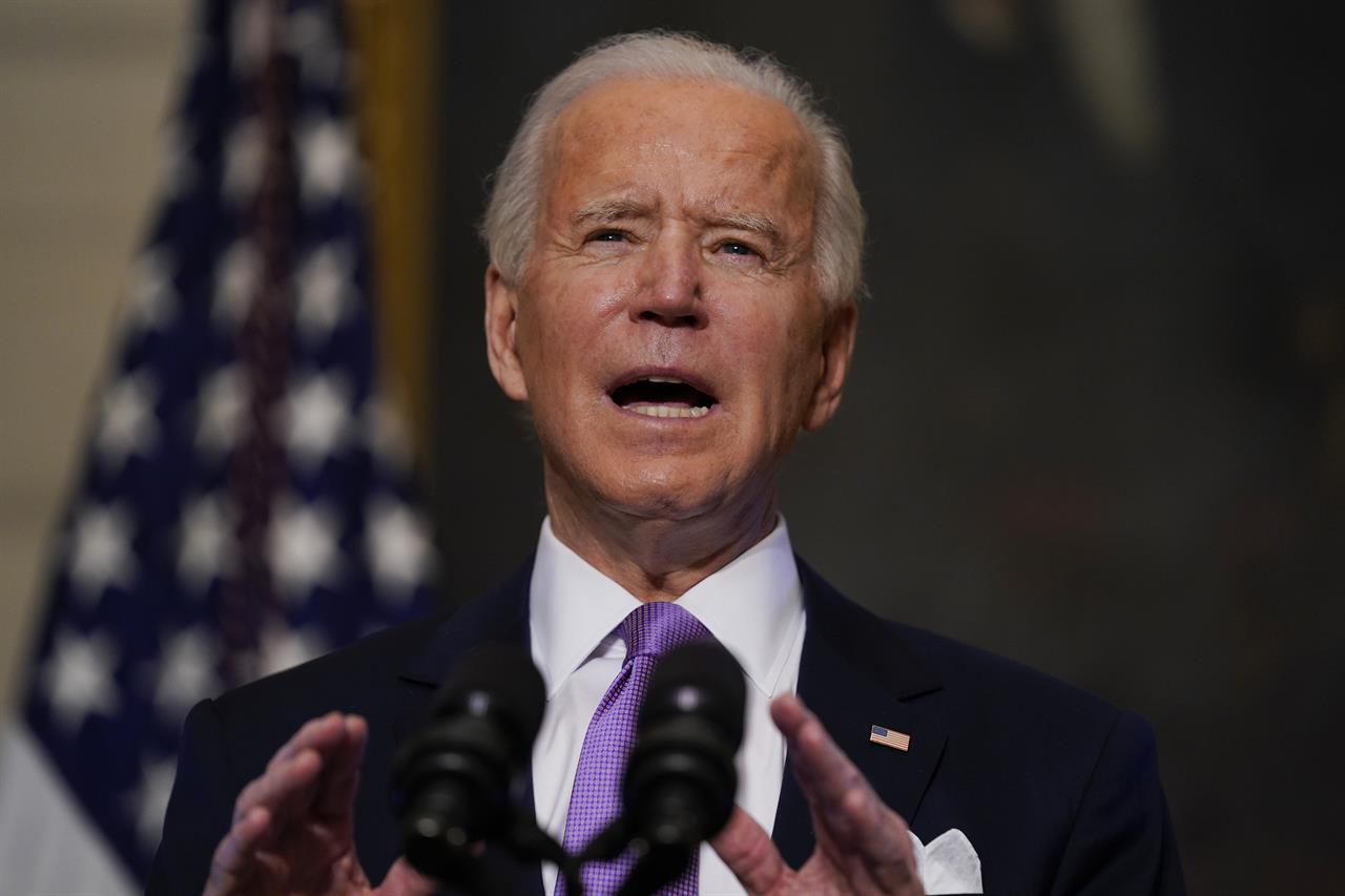 President Joe Biden delivers remarks on COVID-19, in the State Dining Room of the White House, Tuesday, Jan. 26, 2021, in Washington. (AP Photo/Evan Vucci)