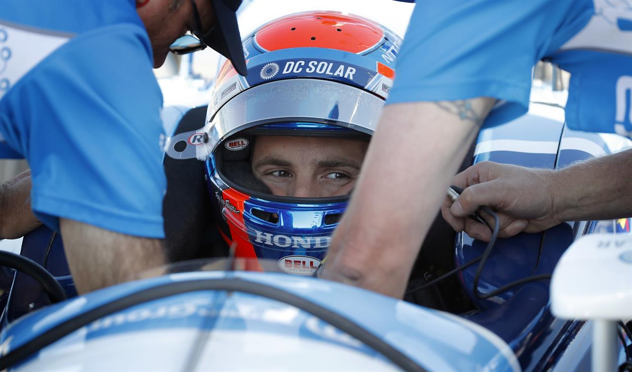 FILE - Ed Jones sits in his car during practice for an IndyCar Series auto race at Iowa Speedway in Newton, Iowa, in this Saturday, July 7, 2018, file photo. Ed Jones will return to IndyCar after a one-year absence for a second stint driving for Dale Coyne Racing. Jones is a British citizen born in the United Arab Emirates who currently lives in Miami. He was sidelined all of 2020 because of COVID-19 travel restrictions. (AP Photo/Charlie Neibergall, File)