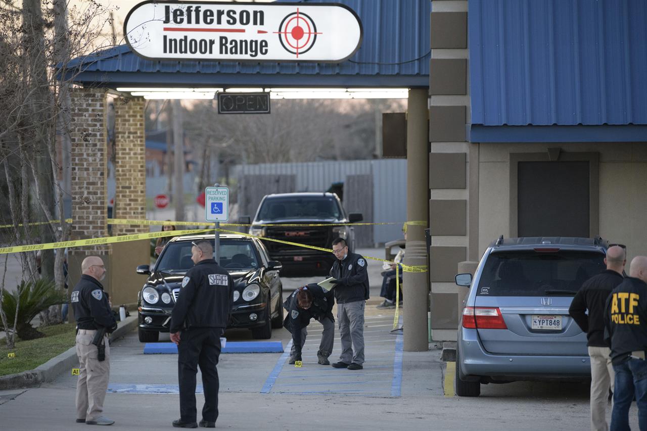 Jefferson Parish Sheriff's Office and Bureau of Alcohol, Tobacco, Firearms and Explosives: ATF investigators look at evidence at the scene of a multiple fatality shooting at the Jefferson Gun Outlet in Metairie, La. Saturday, Feb. 20, 2021. A person went into a gun store and shooting range in a New Orleans suburb and fatally shot two people Saturday, causing customers and staff to open fire on the shooter, said a sheriff. The shooter also died..(AP Photo/Matthew Hinton)