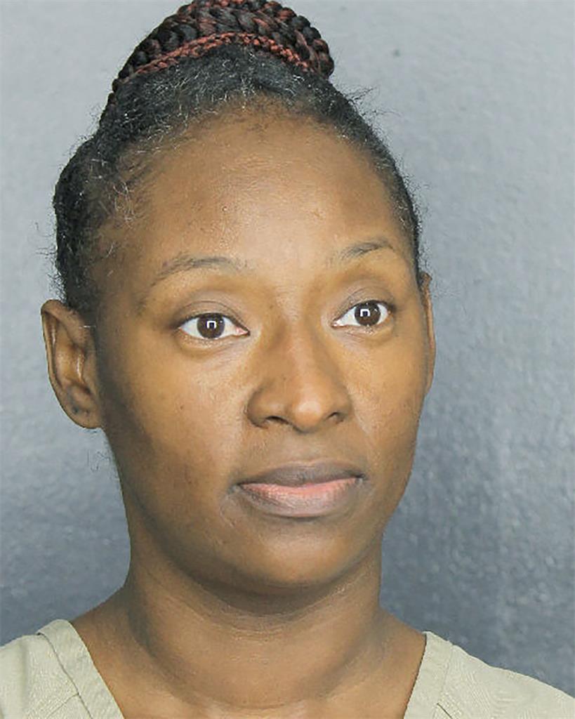 This Friday, Feb. 19, 2021 booking photo made available by the Broward County, Fla., Sheriff's Office, Fla., shows Saprell Frazier who allegedly set fire last fall to 10 garbage trucks outside a solid waste business where she worked has been arrested, authorities said. Frazier, 43, was arrested during a traffic stop on Feb. 19, in Pompano Beach, Fla., a day after being placed under surveillance, according to a Broward Sheriff's Office report. (Broward County Sheriff's Office via AP)