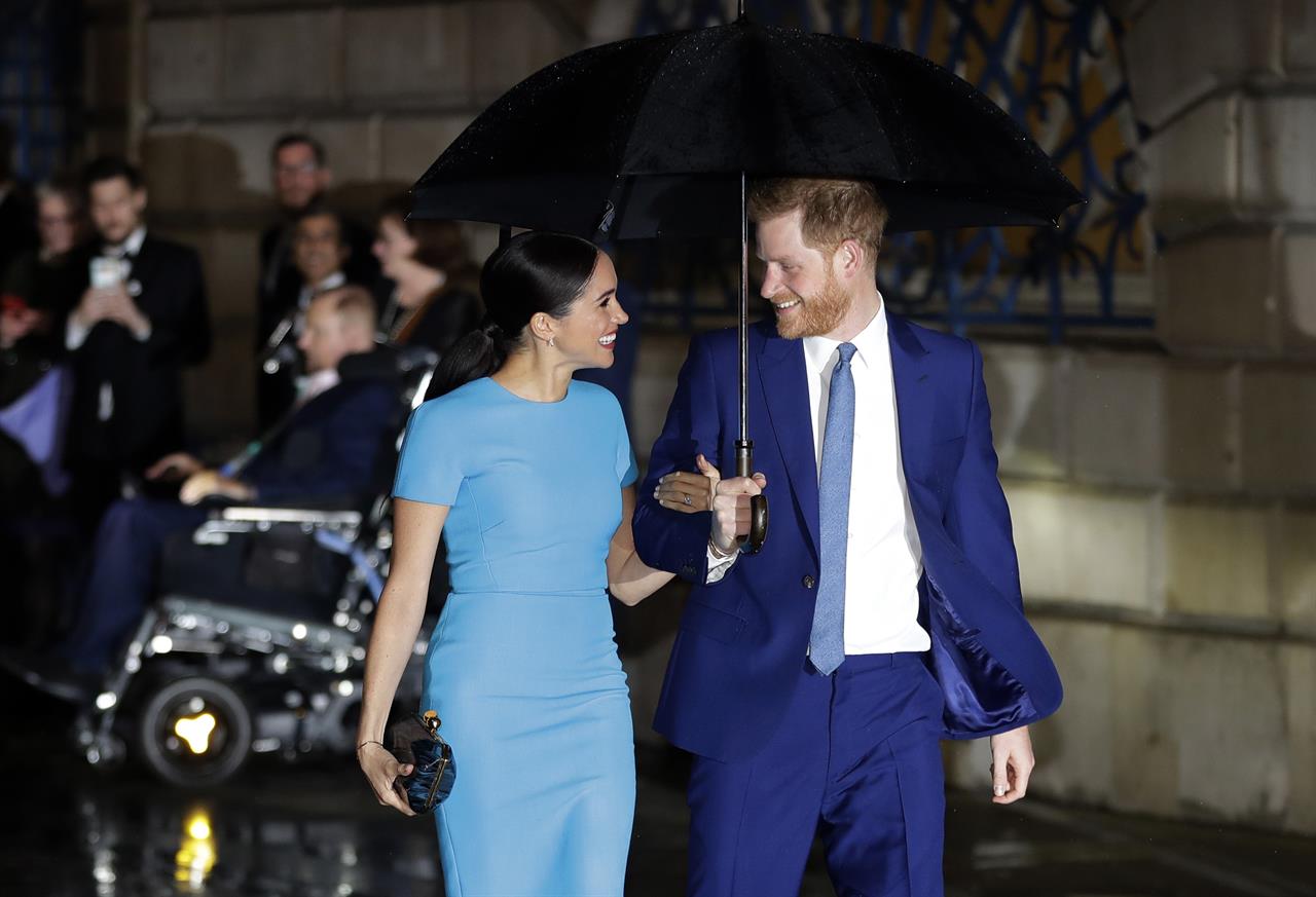 FILE - In this Thursday, March 5, 2020, file photo, Britain's Prince Harry and Meghan arrive at the annual Endeavour Fund Awards in London. The Duke and Duchess of Sussex's foundation has helped support the completion of an emergency relief center in the Commonwealth. World Central Kitchen announced Wednesday, Feb. 24, 2021, that the construction of the first community relief center in Dominica has been completed. (AP Photo/Kirsty Wigglesworth, File)