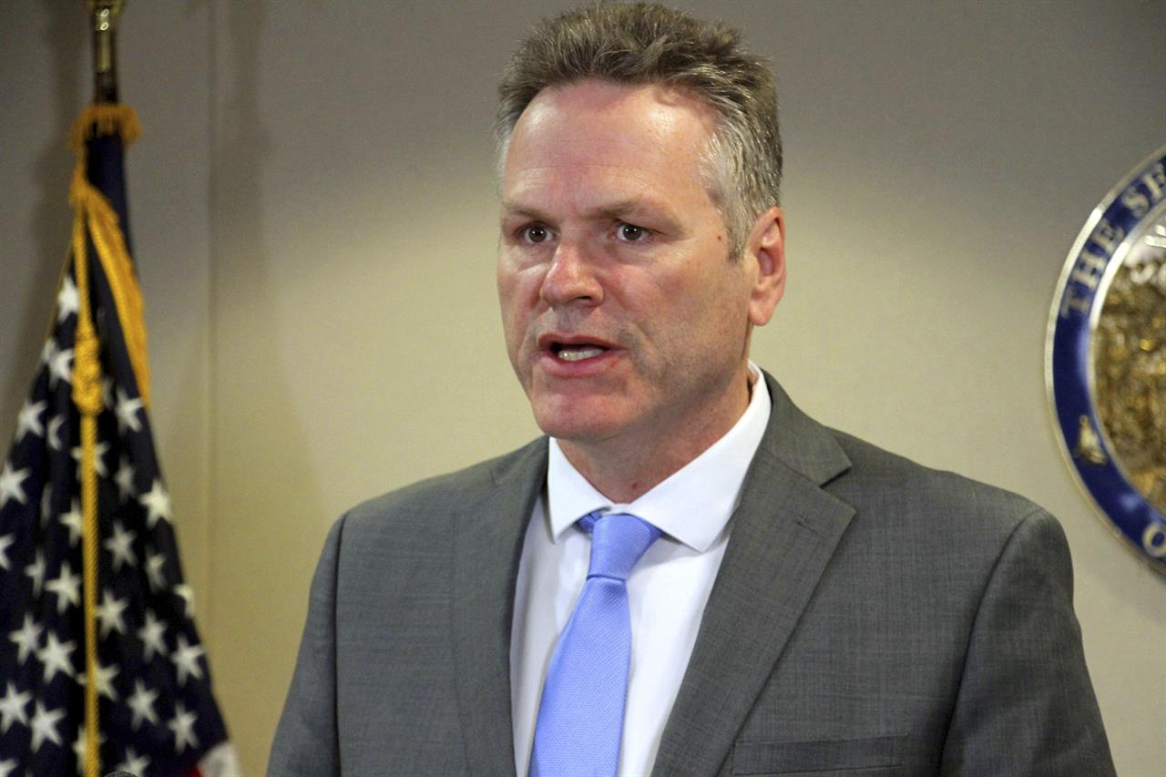 FILE - In this March 9, 2020, file photo, Alaska Gov. Mike Dunleavy addresses reporters at a news conference in Anchorage, Alaska. Dunleavy has mild symptoms of COVID-19 and a state House member also tested positive Wednesday, officials said. Alaska House Speaker Louise Stutes asked members and staff not to enter the state Capitol on Thursday unless necessary to allow for contact tracing and cleaning to occur.. (AP Photo/Mark Thiessen, File)