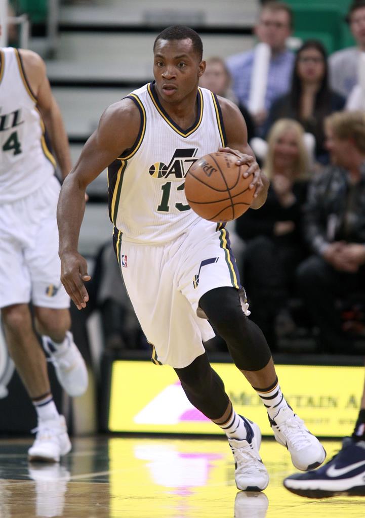 FILE - In this Nov. 23, 2015, file photo, Utah Jazz guard Elijah Millsap brings the ball downcourt against the Oklahoma Thunder in the second half during an NBA basketball game in Salt Lake City. Former Jazz player Millsap alleged this week that Utah executive Dennis Lindsey made a bigoted comment to him in 2015. The Jazz and the NBA are investigating. (AP Photo/George Frey, File)