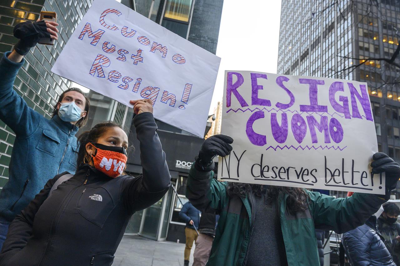 People rally for New York Gov. Andrew Cuomo's resignation in front of his Manhattan office in New York, Tuesday, March 2, 2021. Cuomo is facing calls for resignations from some members of his own party as most leading Democrats signal they want to await the results of the attorney general’s investigation into claims the governor sexually harassed aides. (AP Photo/Brittainy Newman)