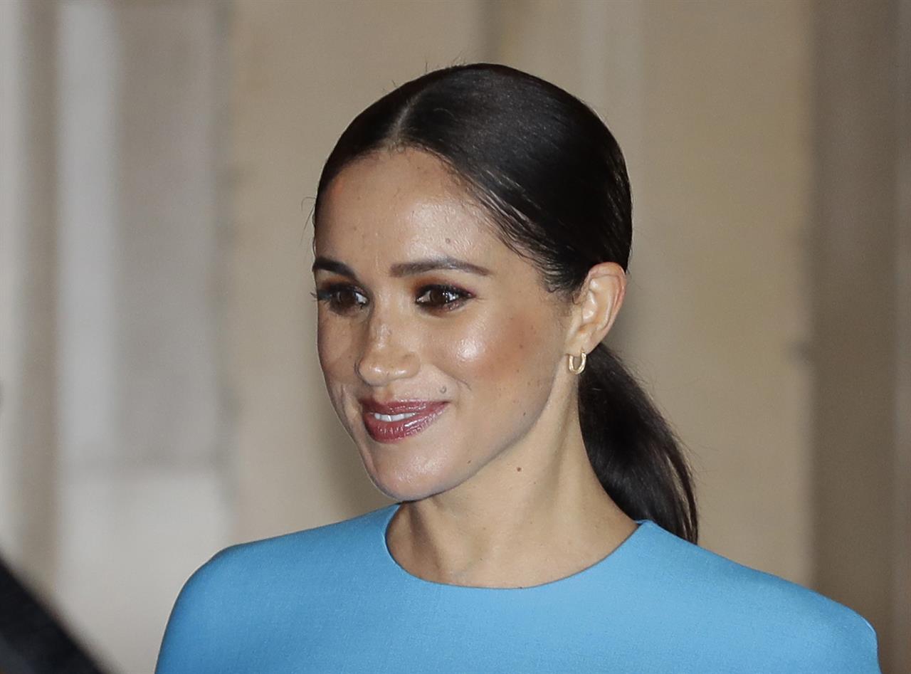 FILE - In this file photo dated Thursday, March 5, 2020, Britain's Meghan, the Duchess of Sussex leaves after attending the annual Endeavour Fund Awards in London. A British newspaper publisher on Tuesday March 2, 2021, is seeking permission to appeal against a judge’s ruling that it invaded the privacy of the Duchess of Sussex by publishing parts of a letter she wrote to her estranged father after her 2018 marriage to Prince Harry. (AP Photo/Kirsty Wigglesworth, FILE)