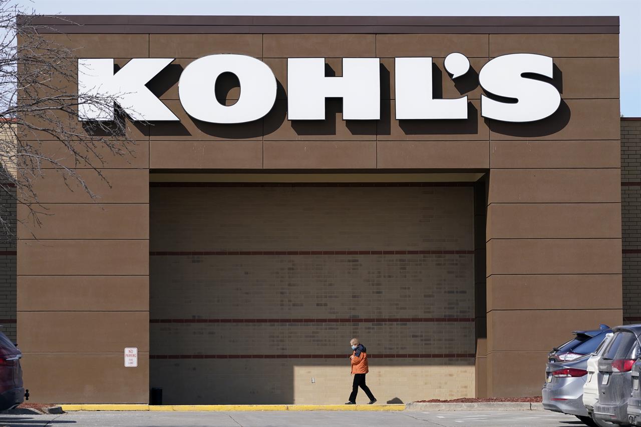 This Thursday, Feb. 25, 2021, photo shows a woman arriving at a Kohl's store in West Des Moines, Iowa. Kohl’s reported mixed results for its fiscal fourth quarter, delivering a 30% increase in profits but a 10% drop in sales. Results announced Tuesday, March 2, handily beat Wall Street estimates. (AP Photo/Charlie Neibergall)