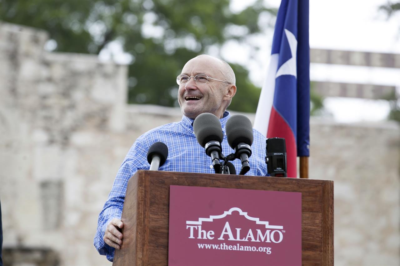 FILE - Singer Phil Collins appears in front of the Alamo to announce his donation of over 200 Texas Revolution-era artifacts to the Texas General Land Office on June 26, 2014. A temporary exhibit, which includes a brass cannon used by the Mexican Army during the Battle of the Alamo and the original battle orders that calling for the attack on the Alamo, is on display beginning Tuesday, March 2, 2021 through April 25. (Julysa Sosa/The San Antonio Express-News via AP, File)