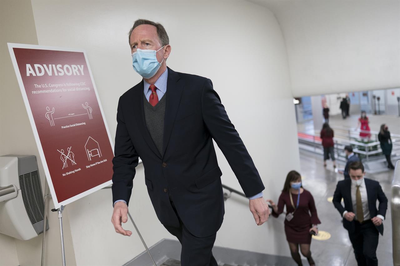 Sen. Pat Toomey, R-Pa., arrives for votes on President Joe Biden's cabinet nominees, at the Capitol in Washington, Thursday, Feb. 25, 2021. (AP Photo/J. Scott Applewhite)