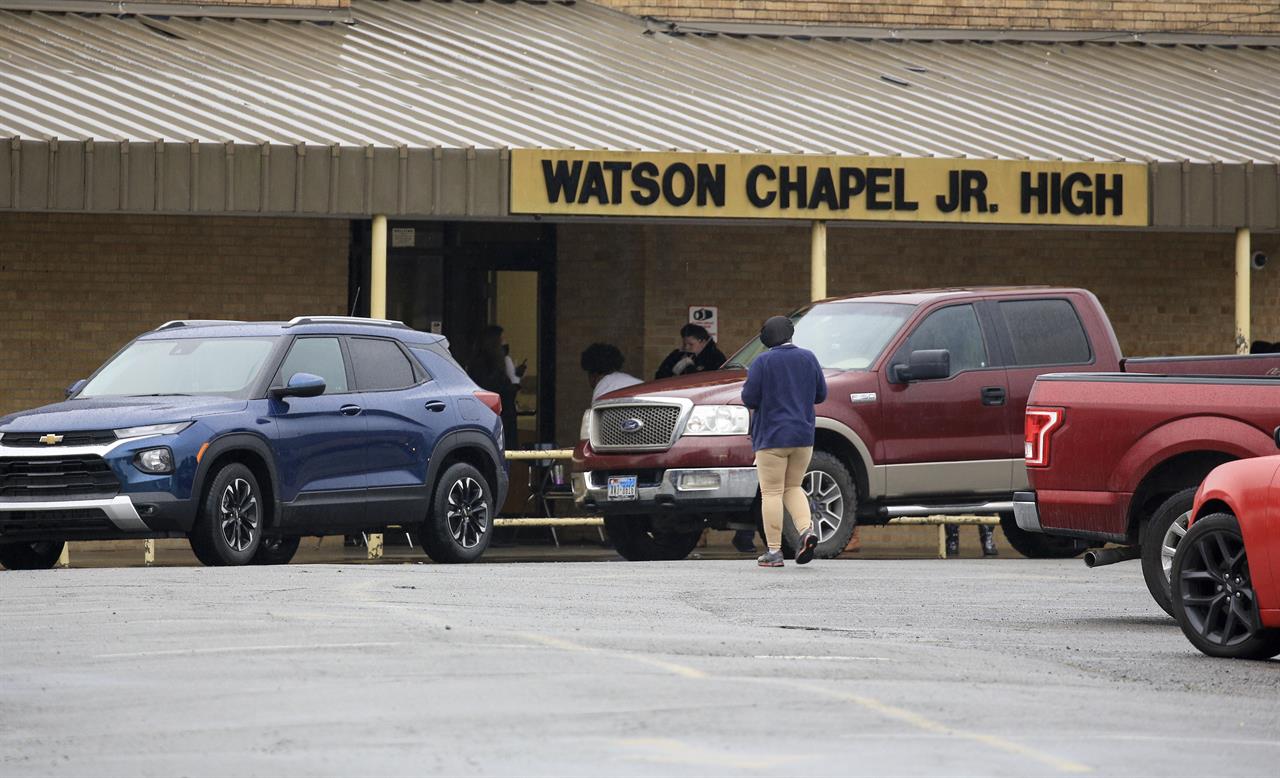 Traffic is lined up Monday March 1, 2021 outside Watson Chapel Junior High School in Pine Bluff, Ark. as parents pick up students after a shooting at the school. (Staton Breidenthal/The Arkansas Democrat-Gazette via AP)