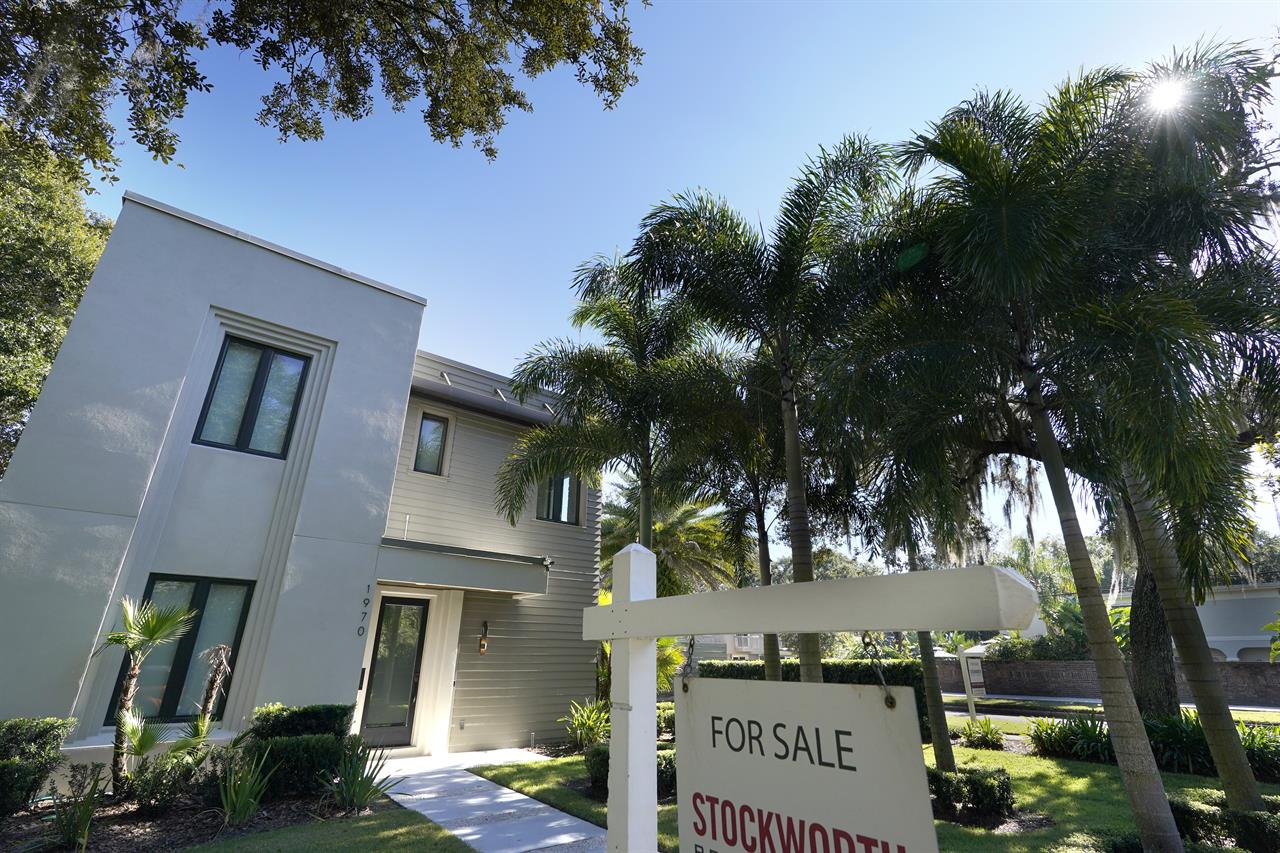 In this A home for sale is seen Tuesday, Dec. 8, 2020, in Orlando, Fla. U.S. long-term mortgage rates were steady to higher this week, Thursday, March 4, 2021, as the benchmark 30-year loan breached the 3% mark for the first time since July 2020. (AP Photo/John Raoux)