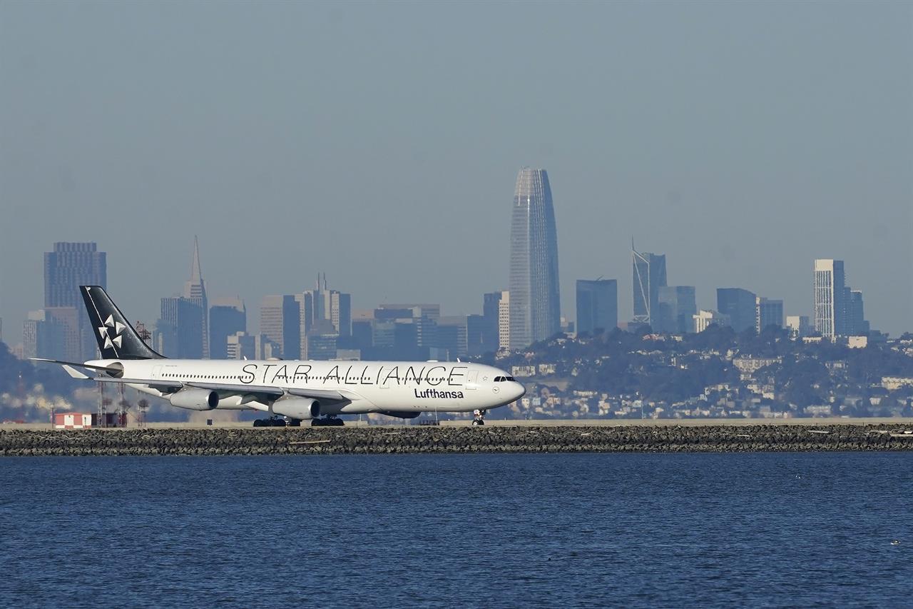 FILE - In this Tuesday, Dec. 22, 2020 file photo, A Lufthansa Star Alliance plane prepares to take off at San Francisco International Airport during the coronavirus pandemic in San Francisco. he hack of a company that manages ticket-processing and frequent-flier data for major global airlines — including Star Alliance and OneWorld members — has compromised the personal data of an unspecified number of travelers. The hackers were able to access some computer systems at Atlanta-based SITA Passenger Service System for up to a month before the incident's seriousness was confirmed on Feb. 24, 2021 a spokesman for the company's Geneva-based parent company said.(AP Photo/Jeff Chiu, File)