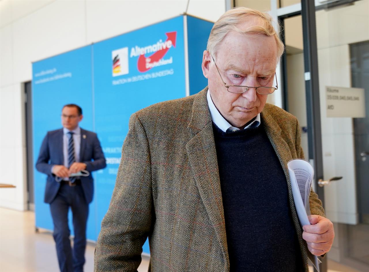 Alexander Gauland, parliamentary party leader of the AfD, walks in front of Tino Chrupalla, federal spokesman of the AfD after a statement in Berlin, Germany, Wednesday, March 3, 2021. The AfD has been classified as a suspected right-wing extremist by the Office for the Protection of the Constitution. (Michael Kappeler/dpa via AP)