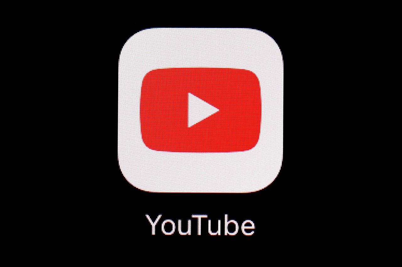 FILE - This March 20, 2018, file photo shows the YouTube app on an iPad in Baltimore. YouTube on Friday, March 5, 2021, said it has removed five channels run by Myanmar’s military for violating its community guidelines and terms of service. (AP Photo/Patrick Semansky, File)
