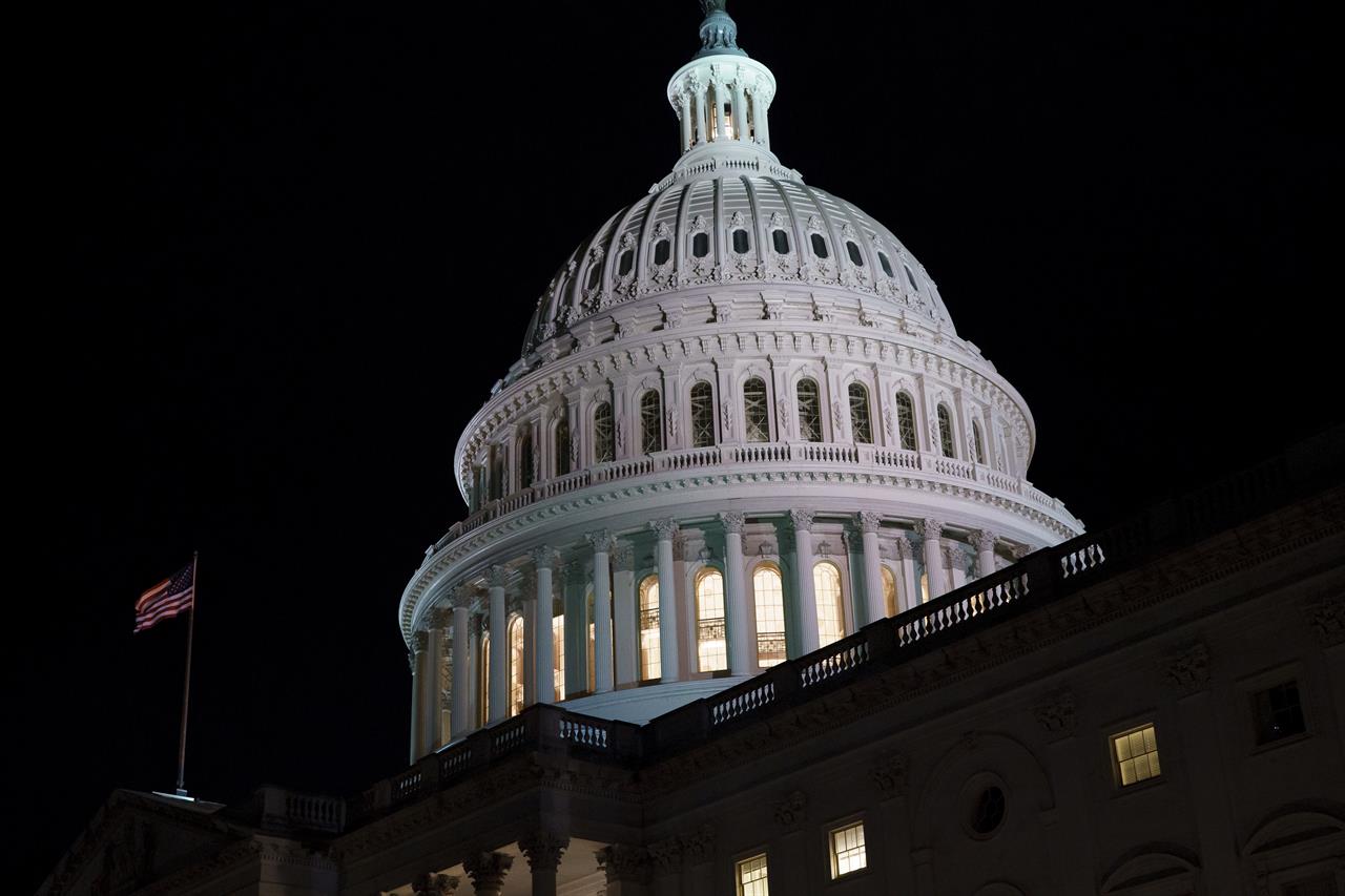 The Capitol is seen at dusk as work in the Senate is stalled on the Democrats' $1.9 trillion COVID-19 relief bill, in Washington, Friday, March 5, 2021. Senators plan to continue to vote on amendments through the night. (AP Photo/J. Scott Applewhite)